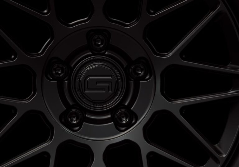 Three-quarter view of a black G24 3-piece wheel from Govad Forged Heritage series