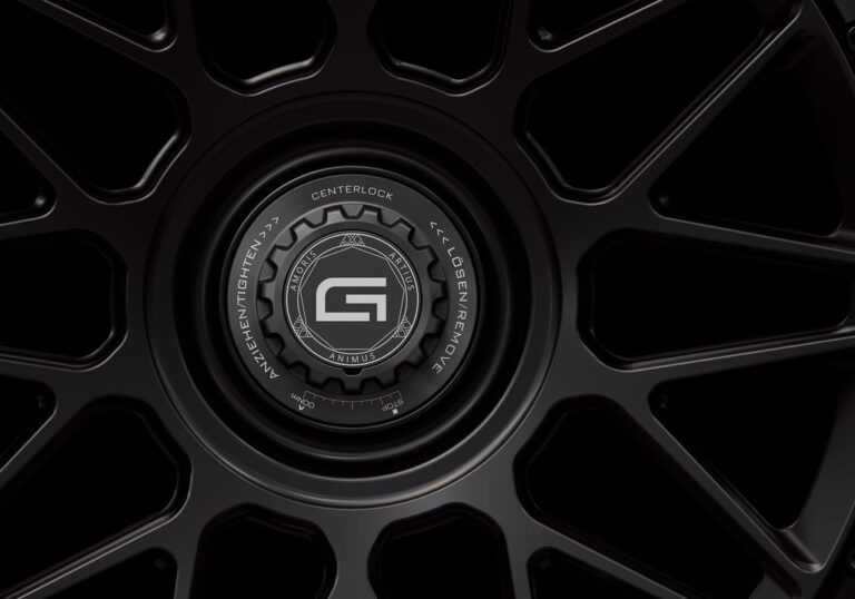 Three-quarter view of a black G24 2-piece centerlock wheel from Govad Forged Carbon8 series with carbon fiber lip