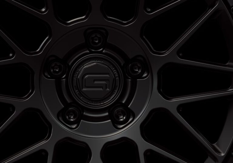 Three-quarter view of a black G24 2-piece wheel from Govad Forged Carbon8 series with carbon fiber lip