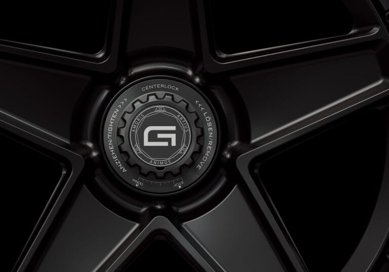 Three-quarter view of a black G25 2-piece centerlock wheel from Govad Forged Carbon8 series with carbon fiber lip