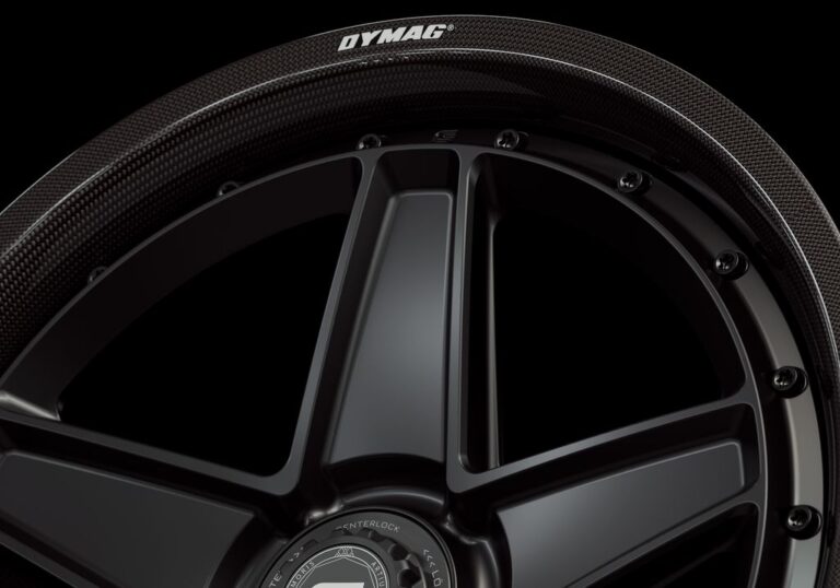 Three-quarter view of a black G25 2-piece centerlock wheel from Govad Forged Carbon8 series with carbon fiber lip