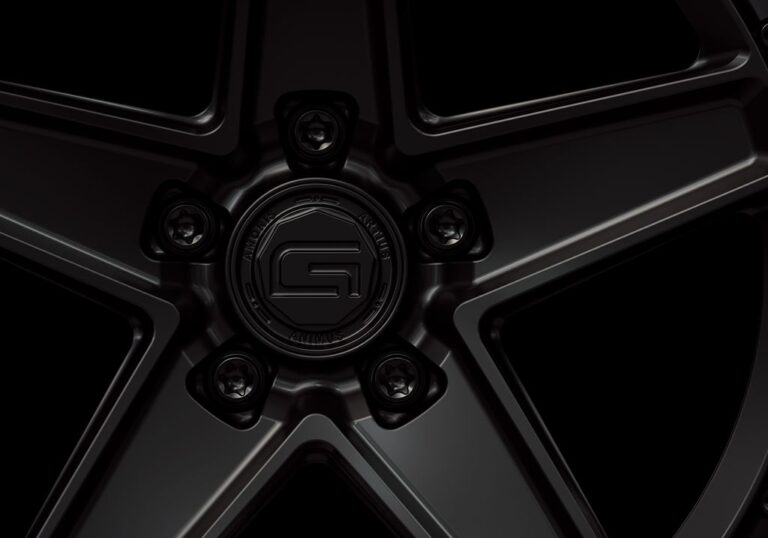 Three-quarter view of a black G25 2-piece wheel from Govad Forged Carbon8 series with carbon fiber lip
