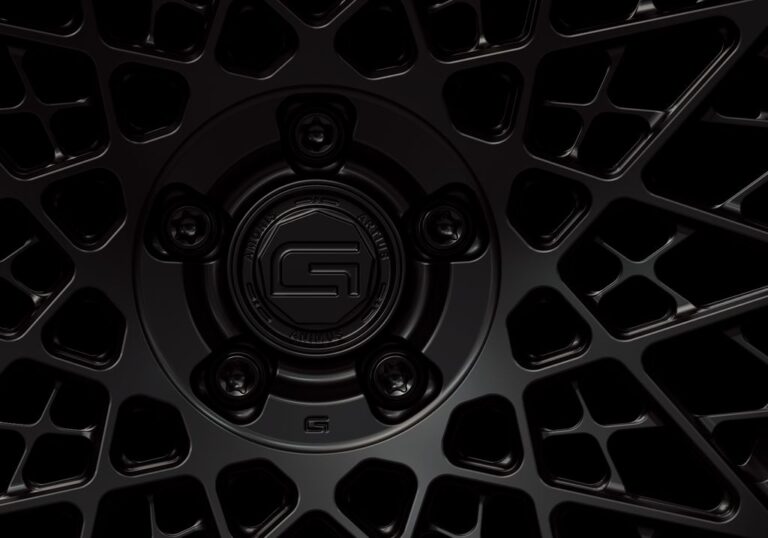 Three-quarter view of a black G28 3-piece wheel from Govad Forged Heritage series