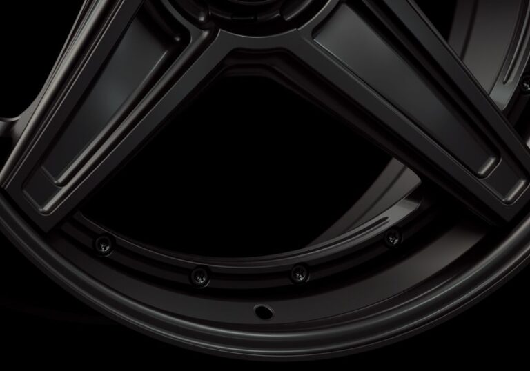 Three-quarter view of a black G44 3-piece flaoting spoke centerlock wheel from Govad Forged Track series