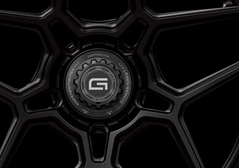 Three-quarter view of a black G45 3-piece flaoting spoke centerlock wheel from Govad Forged Track series