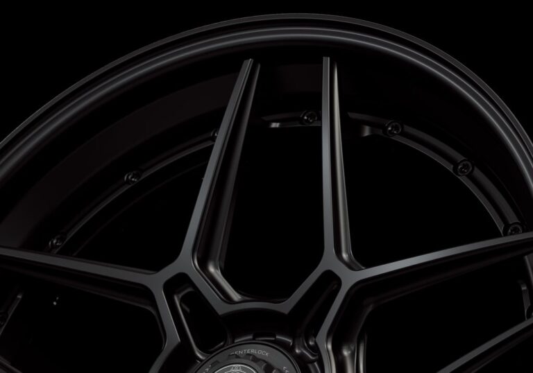 Three-quarter view of a black G45 3-piece flaoting spoke centerlock wheel from Govad Forged Track series