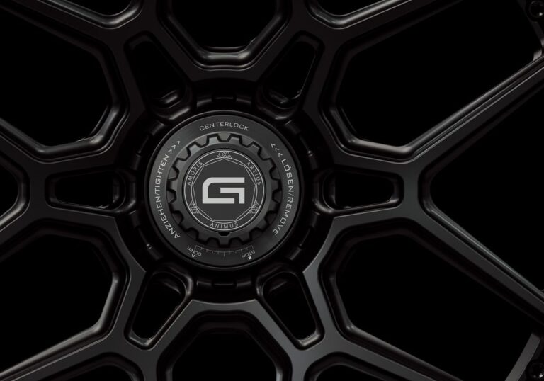 Three-quarter view of a black G46 3-piece flaoting spoke centerlock wheel from Govad Forged Track series