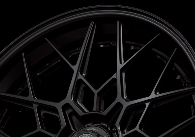 Three-quarter view of a black G47 3-piece flaoting spoke centerlock wheel from Govad Forged Track series