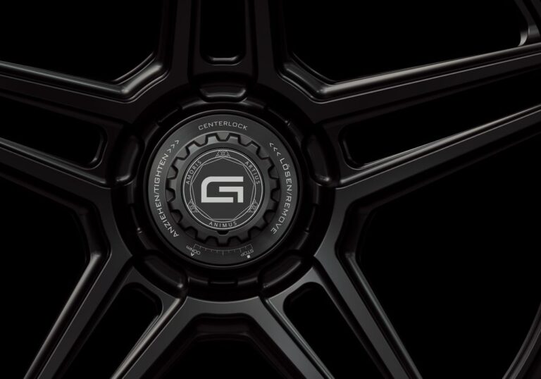 Three-quarter view of a black G51 3-piece flaoting spoke centerlock wheel from Govad Forged Track series