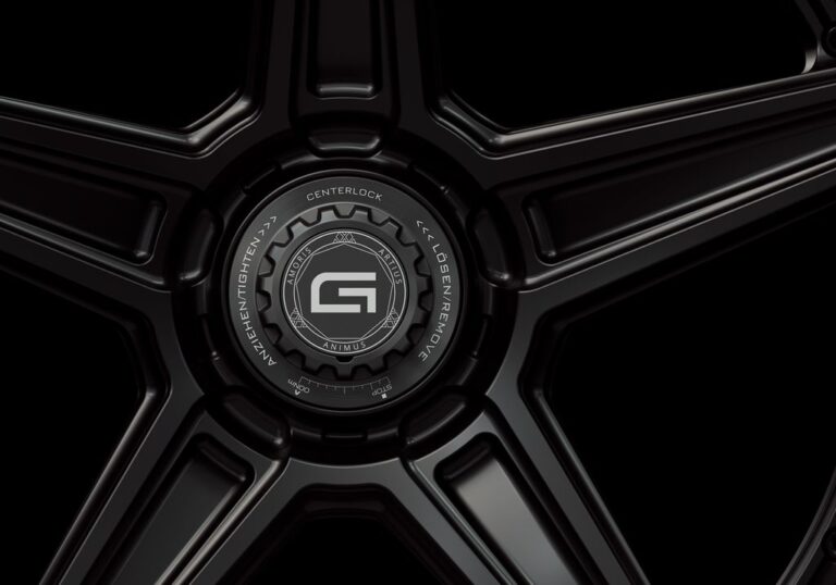 Three-quarter view of a black G52 3-piece flaoting spoke centerlock wheel from Govad Forged Track series