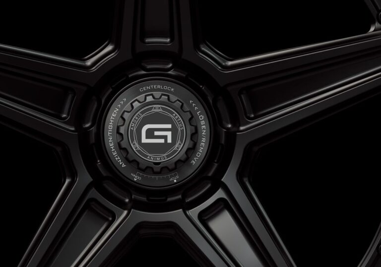 Three-quarter view of a black G52 2-piece centerlock wheel from Govad Forged Carbon8 series with carbon fiber lip