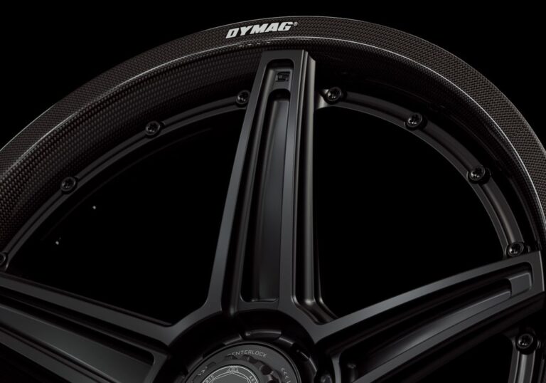 Three-quarter view of a black G52 2-piece centerlock wheel from Govad Forged Carbon8 series with carbon fiber lip
