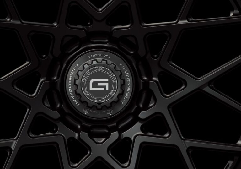 Three-quarter view of a black G53 3-piece flaoting spoke centerlock wheel from Govad Forged Track series