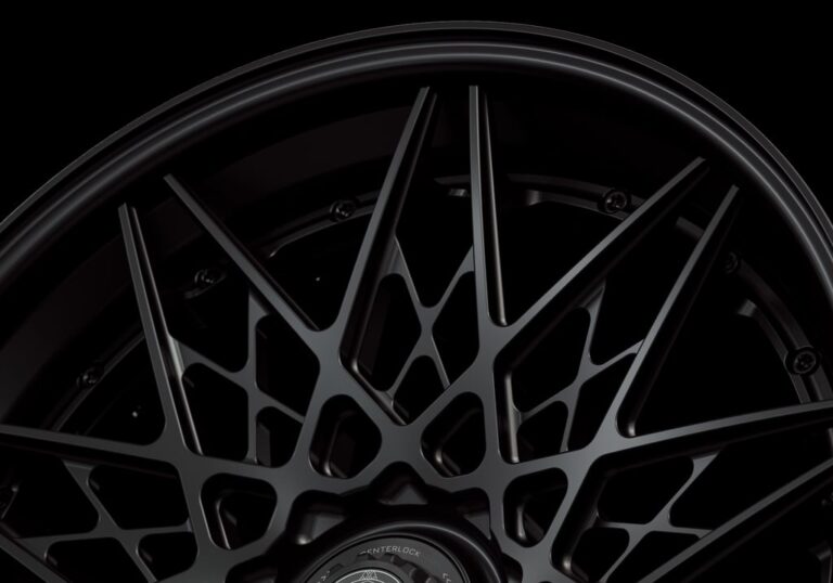 Three-quarter view of a black G54 3-piece flaoting spoke centerlock wheel from Govad Forged Track series