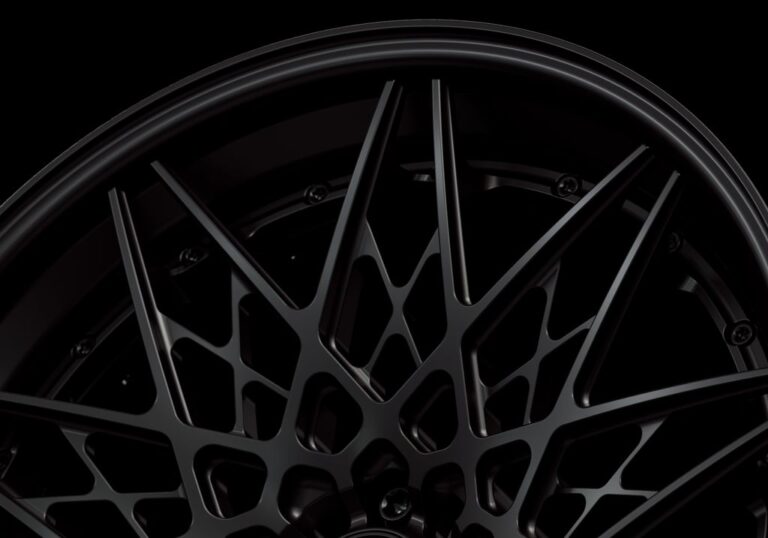 Three-quarter view of a black G54 3-piece flaoting spoke wheel from Govad Forged Track series