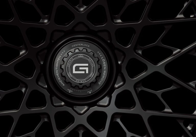 Three-quarter view of a black G55 3-piece flaoting spoke centerlock wheel from Govad Forged Track series
