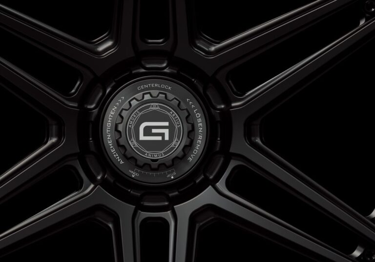 Three-quarter view of a black G56 3-piece flaoting spoke centerlock wheel from Govad Forged Track series