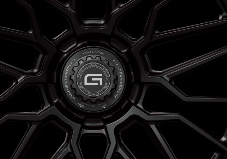 Three-quarter view of a black G57 3-piece flaoting spoke centerlock wheel from Govad Forged Track series