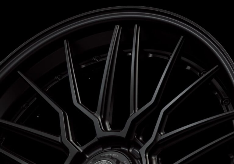 Three-quarter view of a black G57 3-piece flaoting spoke centerlock wheel from Govad Forged Track series