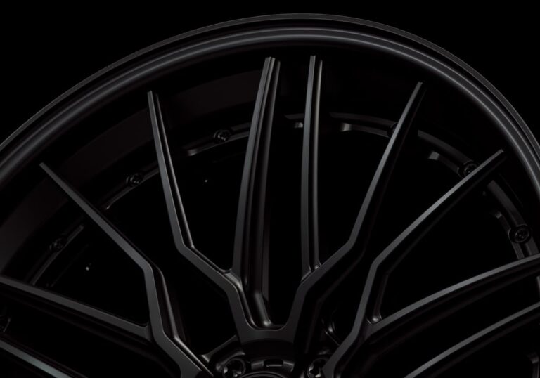 Three-quarter view of a black G57 3-piece flaoting spoke wheel from Govad Forged Track series