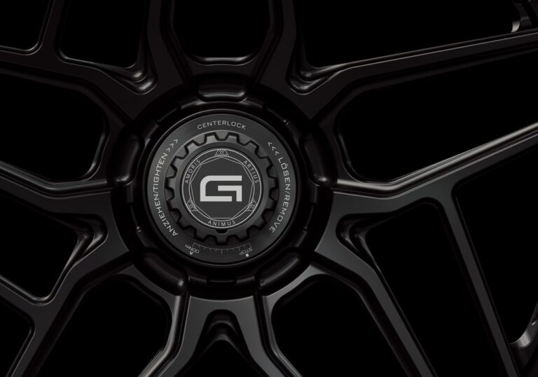 Three-quarter view of a black G58 3-piece flaoting spoke centerlock wheel from Govad Forged Track series