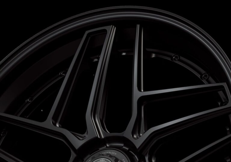 Three-quarter view of a black G58 3-piece flaoting spoke centerlock wheel from Govad Forged Track series