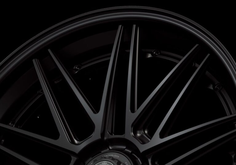 Three-quarter view of a black G59 3-piece flaoting spoke centerlock wheel from Govad Forged Track series