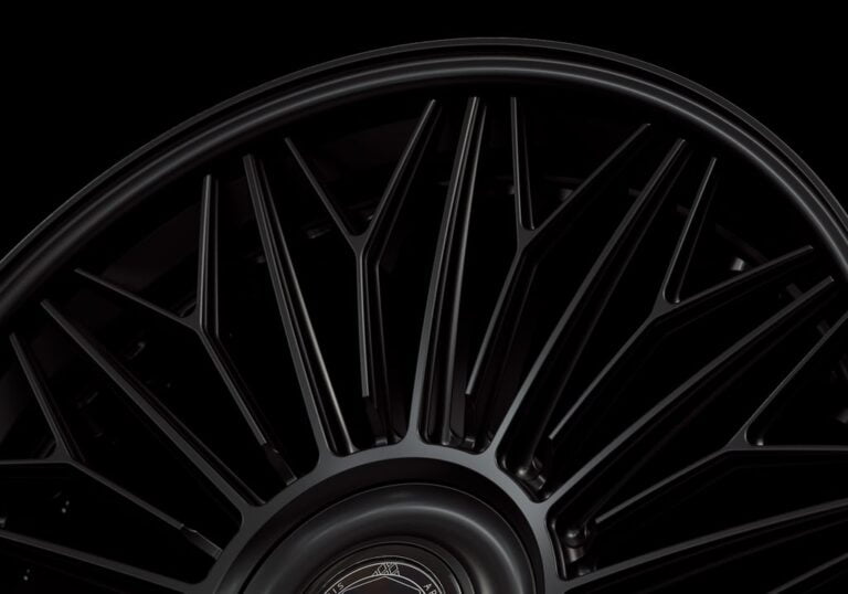 Three-quarter view of a black G700 3-piece flaoting spoke wheel from Govad Forged Luxury series