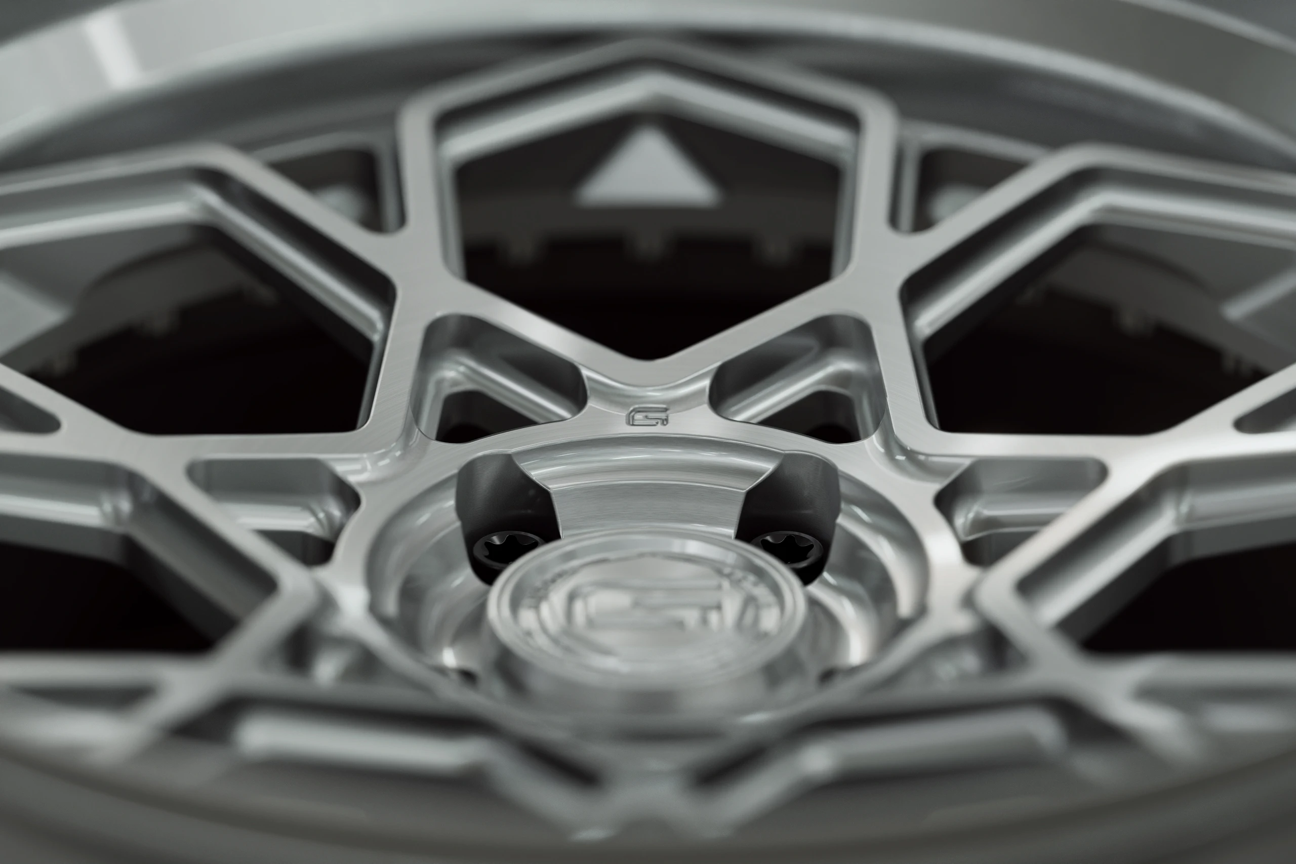 Three-quarter view of a grey G67 3-piece wheel from Govad Forged Evolution series
